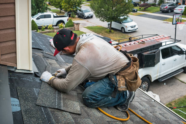 Professional Roof Replacement technician working in Portland, IN